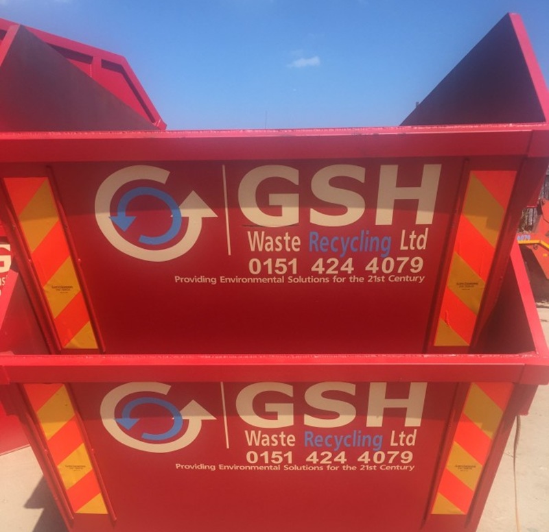 Skips stacked in the sun, ready for domestic skip hire for summer house clearances.